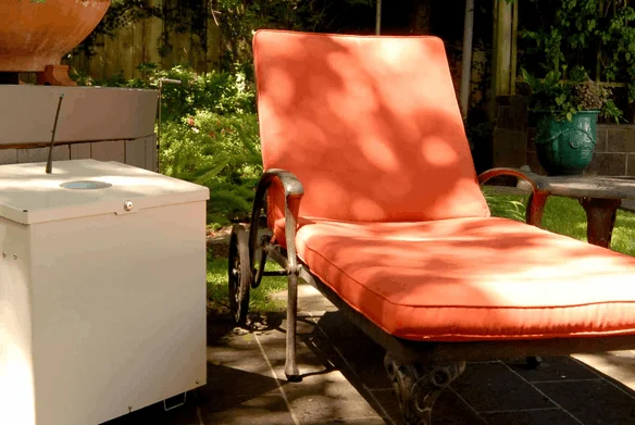 outdoor patio with lounge chair and mosquito misting system
